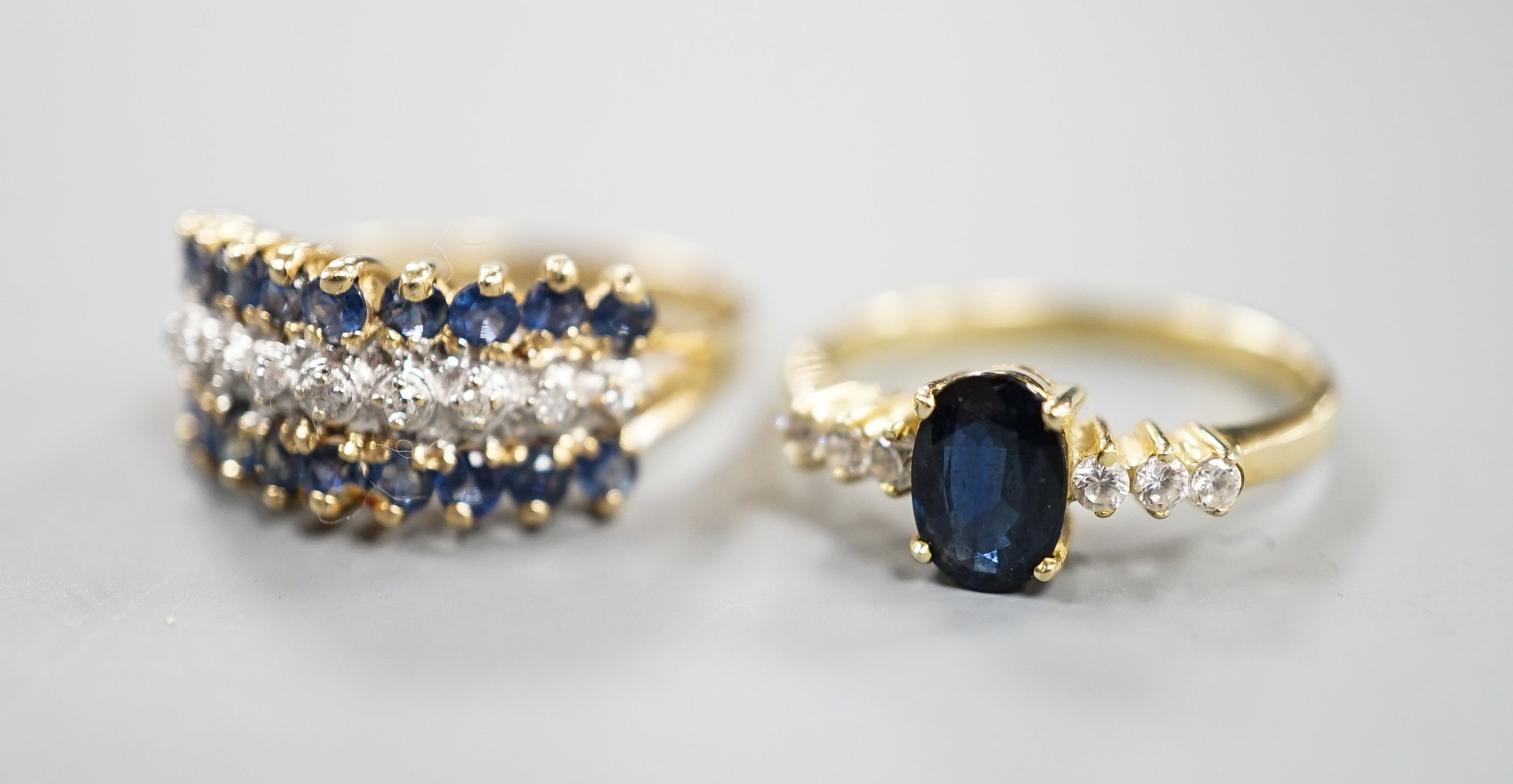 Two modern 14k yellow metal, sapphire and diamond set dress rings, sizes L & K/L, gross weight 5.1 grams.